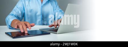 Businessman using tablet to login represents protection concept of cyber security and data security including secure login. Stock Photo
