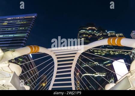 View of public sky walk backlight at Chong Nonsi pedestrian bridge in Empire Tower Bangkok, Thailand 27 december 2023 Stock Photo