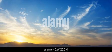 Panoramic view sky sunset cirrus clouds mountains Stock Photo