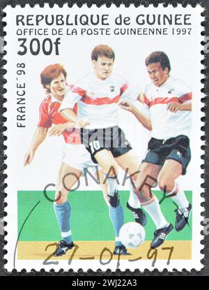 Cancelled postage stamp printed by Guinea, that shows Football players, promoting FIFA World Cup in France 98, circa 1997. Stock Photo