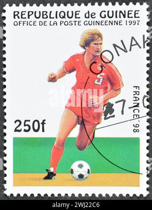 Cancelled postage stamp printed by Guinea, that shows Football players, promoting FIFA World Cup in France 98, circa 1997. Stock Photo