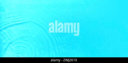Transparent blue color water ripple with copy space. Defocused and blurred surface with splash, bubble and shining. Stock Photo