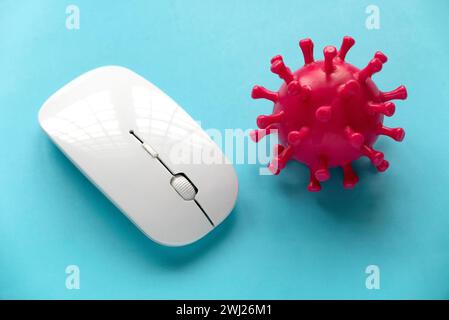 Virus threat in technology. Computer mouse and virus model. Stock Photo