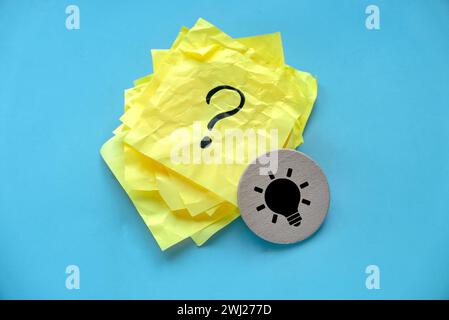 Concept of creative thinking idea and problem solving. Light bulb icon and question mark. Stock Photo