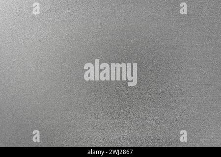 Monochrome texture of shiny grained metal. Abstract background for design. Stock Photo