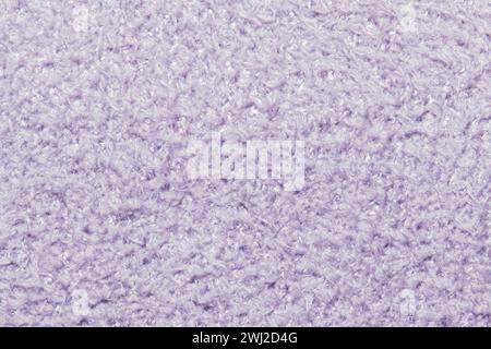 This image captures the detailed texture of a soft, lavender-colored fabric that appears plush and cozy. Stock Photo