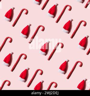 Seamless Christmas texture made of random candy cane and shadow on pink background Stock Photo