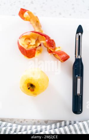Peeling red apples Stock Photo