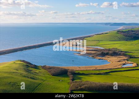 Abbotsbury, Dorset, UK.  12th February 2024.  UK Weather.  Aerial view of Abbotsbury Swannery at Abbotsbury on the Dorset Jurassic Coast on a warm sunny afternoon.  Picture Credit: Graham Hunt/Alamy Live News Stock Photo