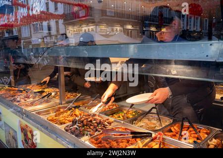 Eat as much as you like hot buffet at a Chinese restaurant in Chinatown on 5th February 2024 in London, United Kingdom. Many people eat bargain food responsibly and it provides great value for consumers, however concerns over obesity levels in the UK remain, especially with foods containing high levels of fat and sugar. Obesity is a medical condition in which excess body fat has accumulated to the extent that it may have a negative effect on health. Stock Photo