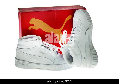 Close-up view of high-top white Puma sneakers with red box on white background. Sweden. Stock Photo