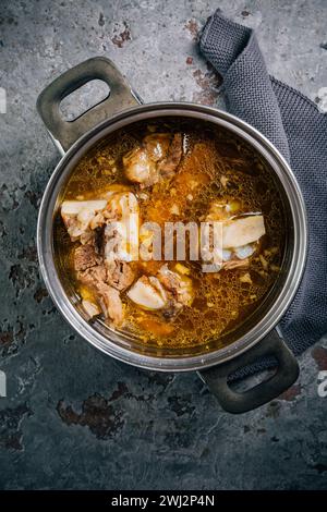 Homemade beef bone broth, rich on collagen, amino acids and proteins Stock Photo