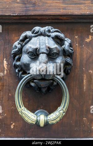 old vintage weathered silver door knocker, weathered and aged Stock Photo
