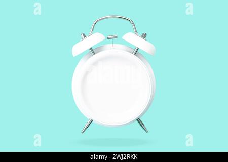 Top view Creative layout of bell Alarm clock with blank plate hovering over green pastel background. Stock Photo