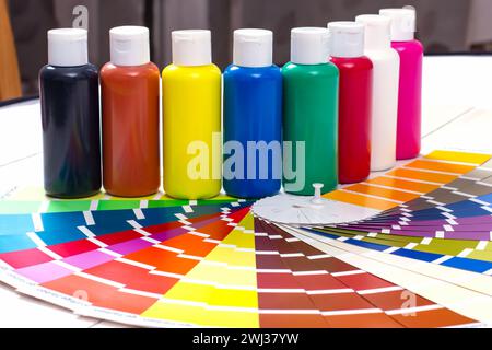 Color palette, tubes of paint on white wooden background Stock Photo
