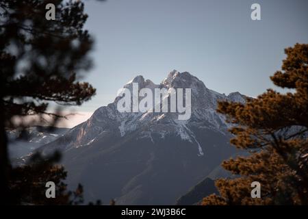 The Pedraforca mountain in Catalonia peeking through a tranquil forest at dawn Stock Photo