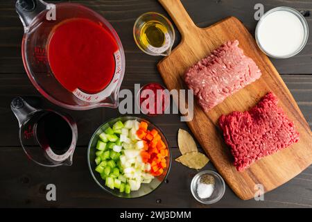 Prepped Ingredients for Authentic Bolognese Sauce: Chopped vegetables, measured passata, and other measured ragu alla bolognese ingredients Stock Photo
