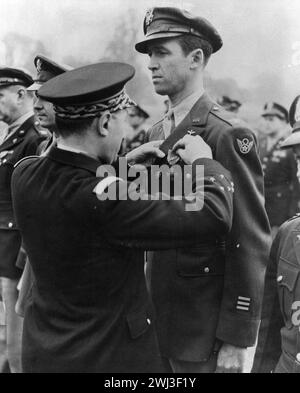 Lt. Gen. Valin, Chief of Staff, French Air Force, awarding Croix De Guerre with palm to Col. James Stewart - Photo by the US Air Force 1944 Stock Photo