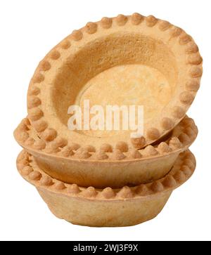 Stack of empty baked round canape baskets isolated on white background, close up Stock Photo