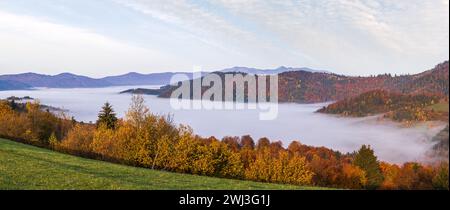 Morning foggy clouds in autumn mountain countryside.  Ukraine, Carpathian Mountains, Transcarpathia. Stock Photo