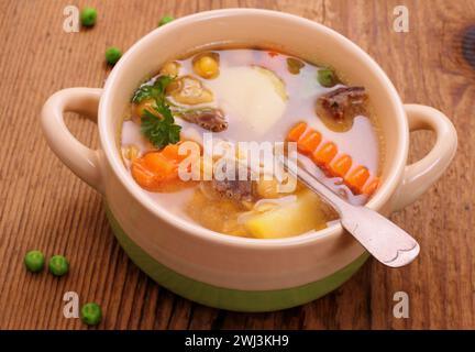 Yellow pea soup, stew meat and potato Stock Photo