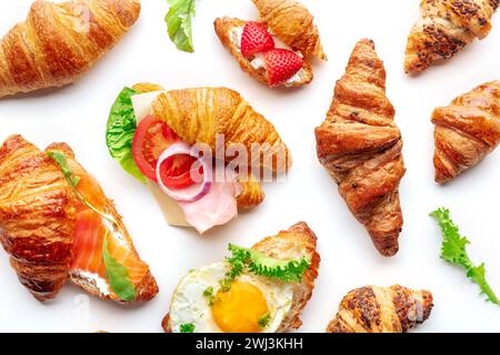Croissant sandwich variety. Various stuffed croissants, overhead flat lay Stock Photo