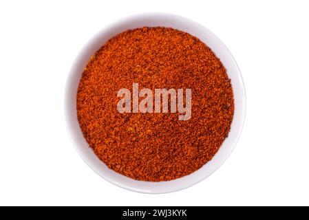 Composition consisting of variations of spices in white bowls and metal spoons Stock Photo