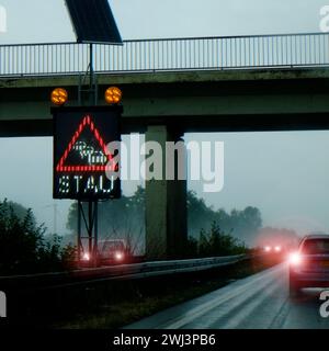 Warning sign on the highway Stock Photo