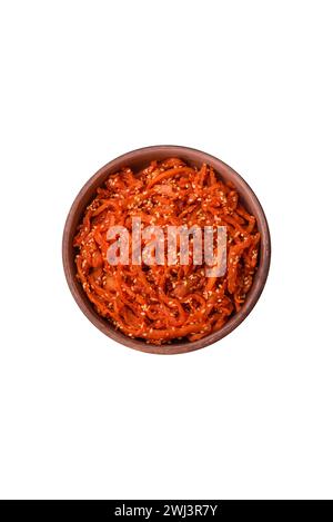 Dried squid chopped into slices and seasoned with sesame seeds and spices Stock Photo