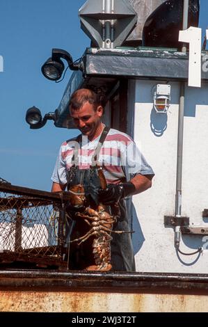 Lobstering off the coast of cap aux Meules, Isles d' Madeleine, Magdalen Islands, in the Gulf of St Lawrence, Quebec, Canada Stock Photo