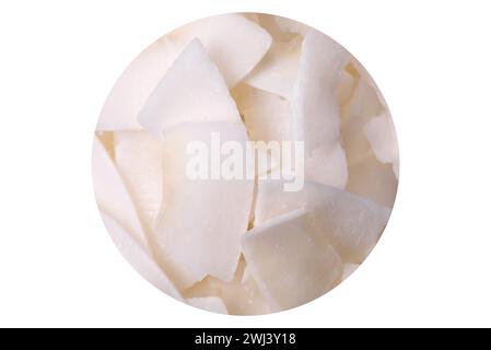 White dry coconut flakes in a wooden bowl prepared for making desserts Stock Photo