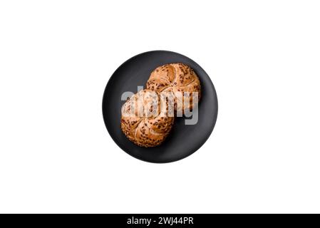 Delicious freshly baked crispy bun or kaiser roll with sesame seeds Stock Photo