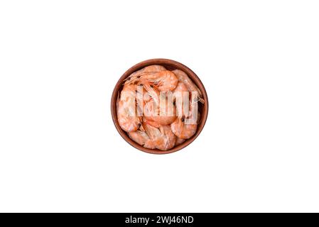 Delicious fresh boiled tiger prawns with salt and spices on a ceramic plate Stock Photo