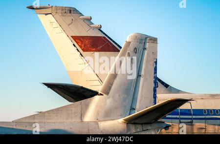 Tail and wings of large old airliners with the symbol of the Soviet Union Stock Photo