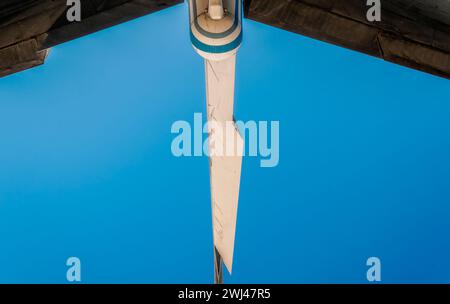 Wings of a large airliner on a blue background Stock Photo