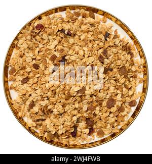 Oatmeal, raisins, cashews and almonds. Granola in round plate Stock Photo