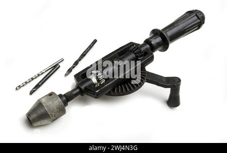 Grandfathers old hand-cranked drill on a white background Stock Photo