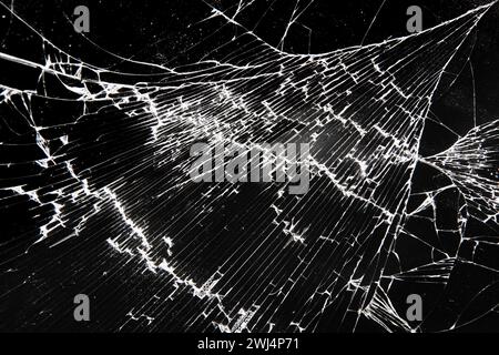 Broken glass texture on black background Stock Photo