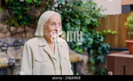 Distracted great grandmother looking away in a nursing home Stock Photo