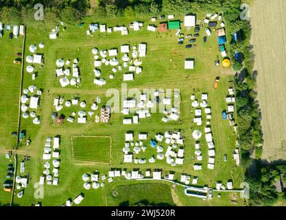 Aerial view of a tent camp and market stalls at a medieval spectacle ...