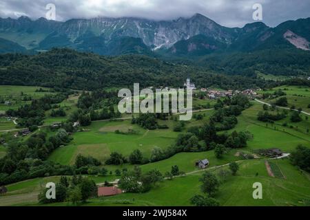 DreÅ¾nica village, Slovenia. Drone aerial view. Picturesque rural green landscape Stock Photo