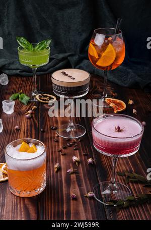 Different colorful exotic alcoholic cocktails on wood Stock Photo