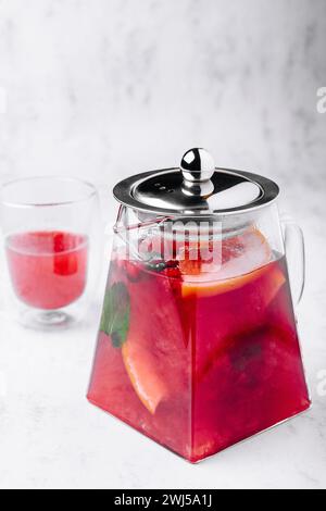 Strawberry, orange and basil sparkling punch, spring cocktail Stock Photo