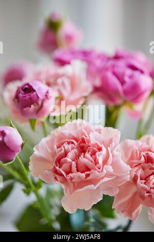 Bouquet of lilac roses and pink carnations. Close up Stock Photo