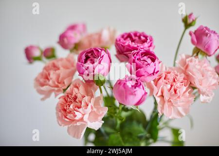 Bouquet of lilac roses and pink carnations Stock Photo