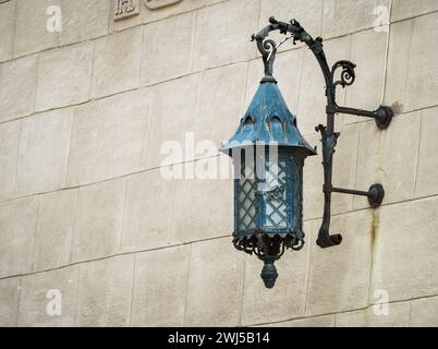 Antique lantern on a stone wall Stock Photo