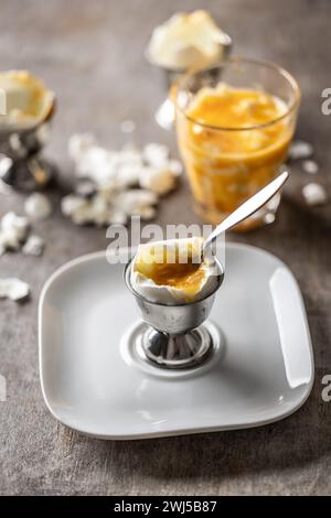 Soft-boiled eggs in a glass cup for breakfast. Stock Photo