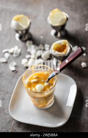 Soft-boiled eggs in a glass cup for breakfast. Stock Photo