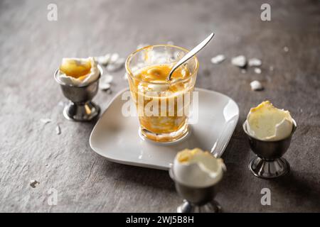Soft-boiled eggs in a glass cup for breakfast. Stock Photo