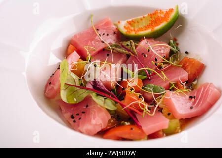 Smoked salmon salad in white bowl close up Stock Photo